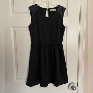 Annabella size small Black Dress with Faux Leather Details and Open Back